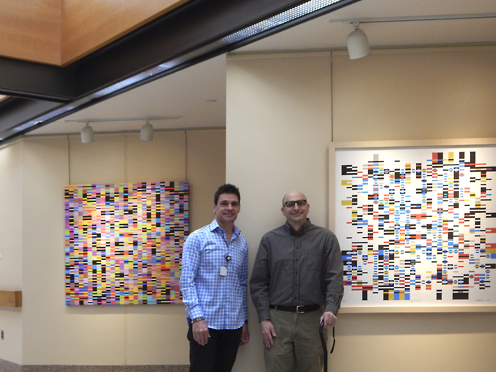 Tom Huck, Curator of Art at University Hospitals With Andrew Reach in Front of his work